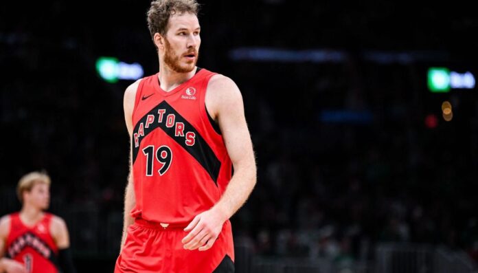 Jakob Poeltl wearing his Raptors jersey