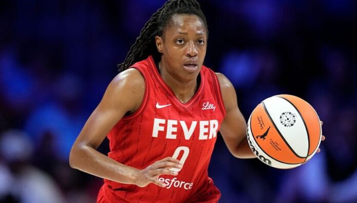 Kelsey Mitchell wearing her Indiana Fever's jersey