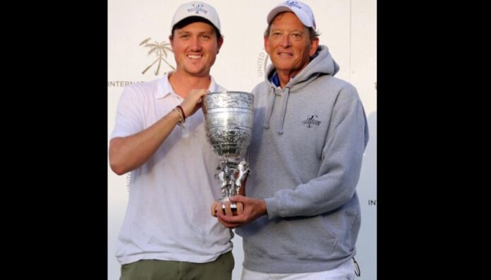 Bob Jornayvaz with his son Robert holding a trophee