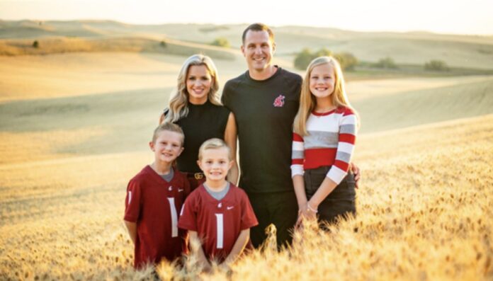 Jake Dickert with his wife Candice and three children