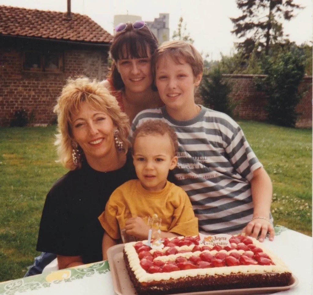 Young Rudy Gobert with his siblings and mother