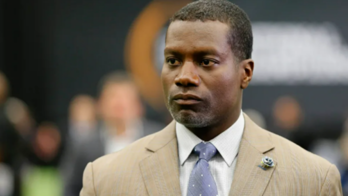 Joey Galloway wearing a suit