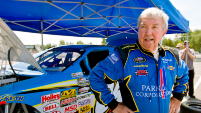 Hershel McGriff standing infront of a car